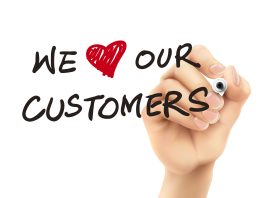 we love our customers words written by 3d hand we love our customers words written by 3d hand over white background